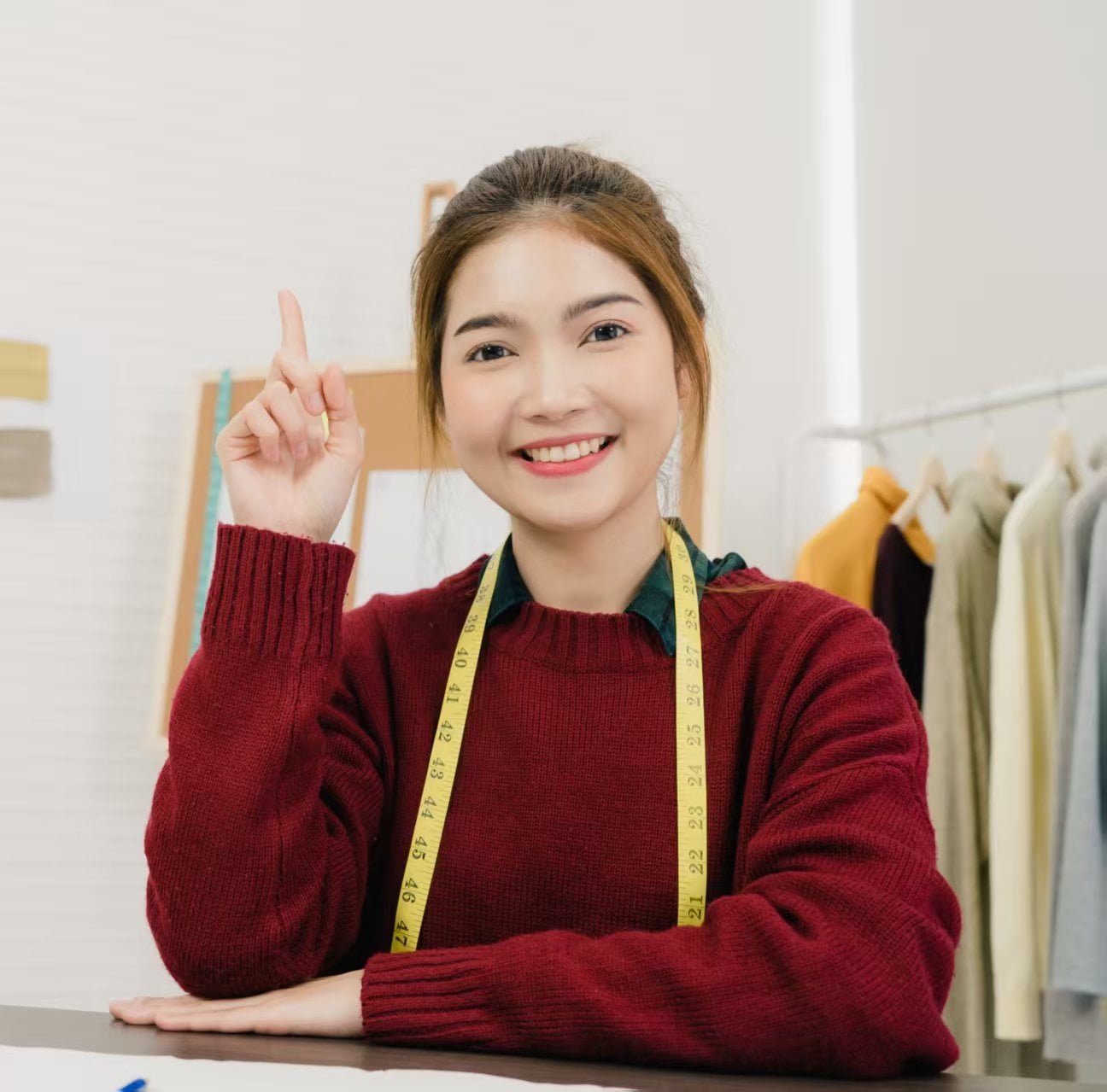 Consultation session with fabric samples and design sketches